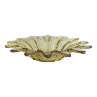 Empty pocket in yellow translucent blown glass, ashtray.
