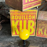 Vintage yellow wooden wall-mounted ball coat hook.