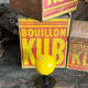 Vintage yellow wooden wall-mounted ball coat hook.