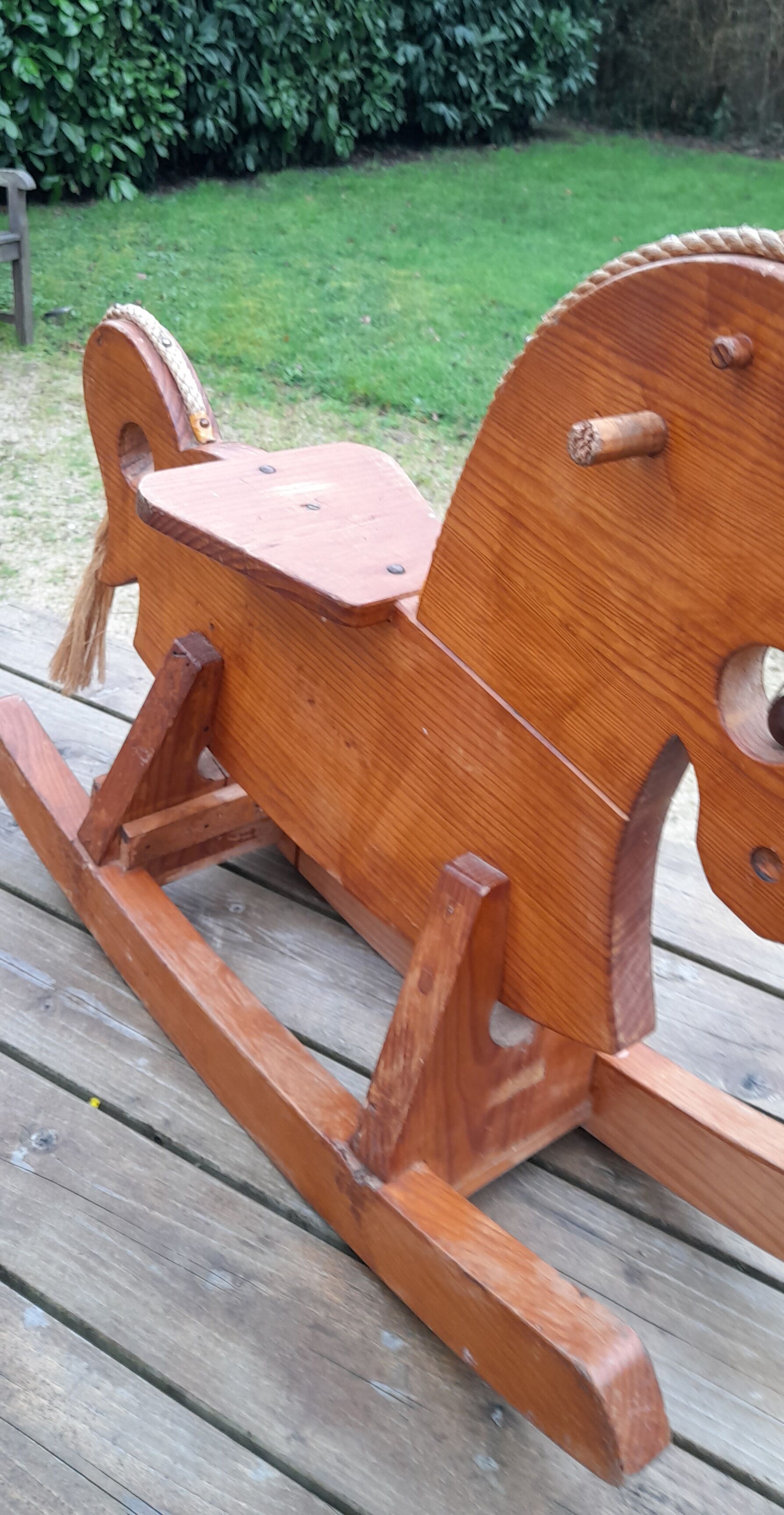 Rocking horse in raw and glazed wood