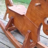Rocking horse in raw and glazed wood