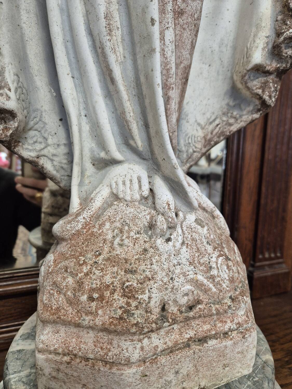 Garden statue of the Virgin Mary in old reconstituted stone