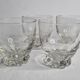 Set of four Art Deco style engraved crystal glasses on spherical feet