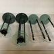 Four postmodernist green marble candlesticks