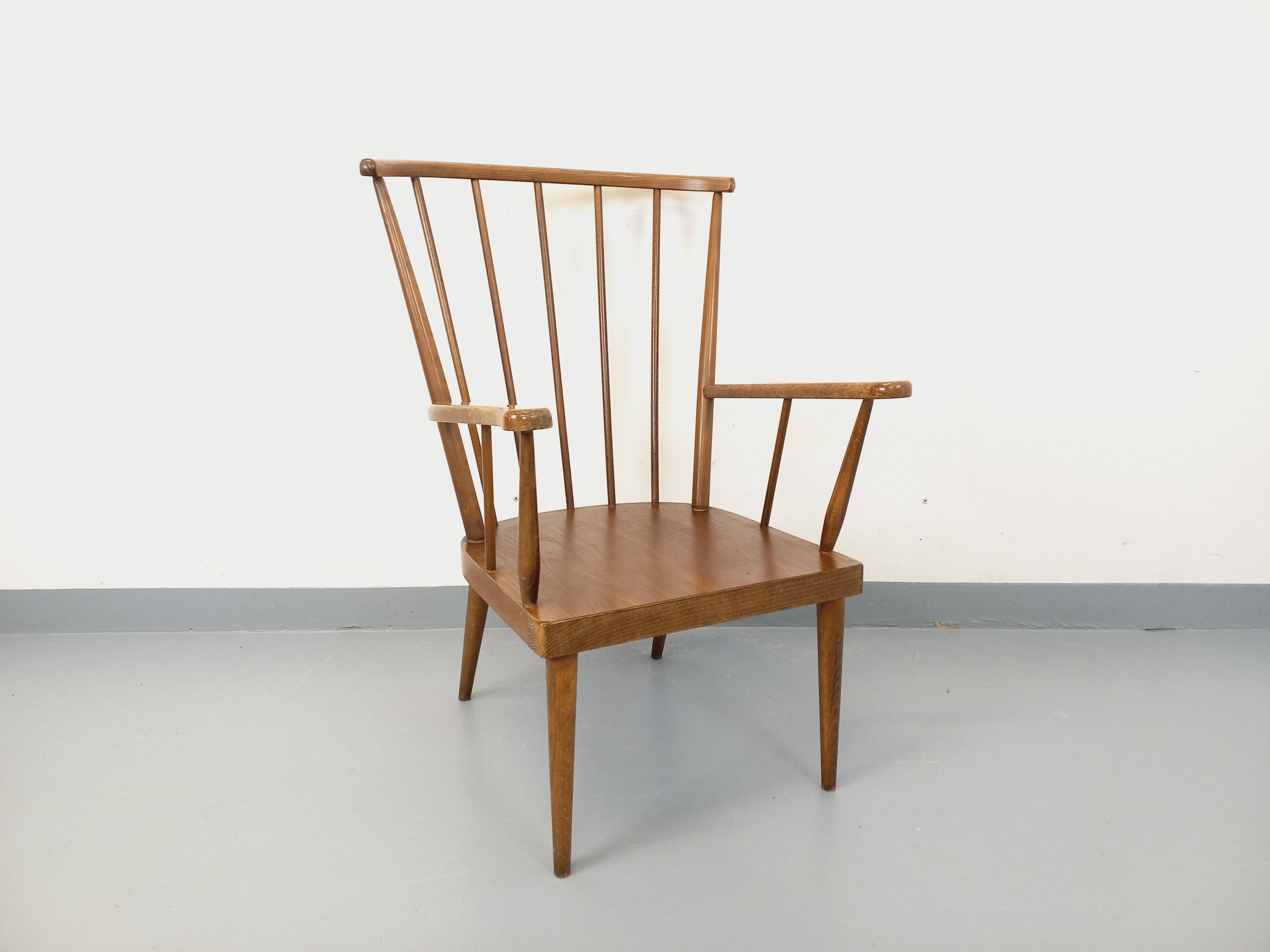 Vintage wooden armchair Baumann model Éventail from the 1960s.