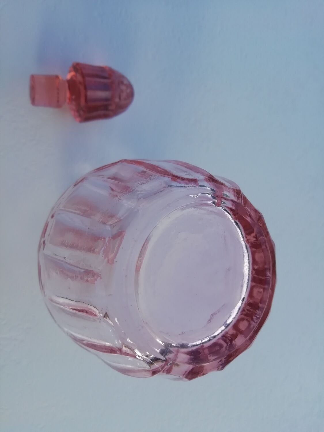 Pink molded glass bottle