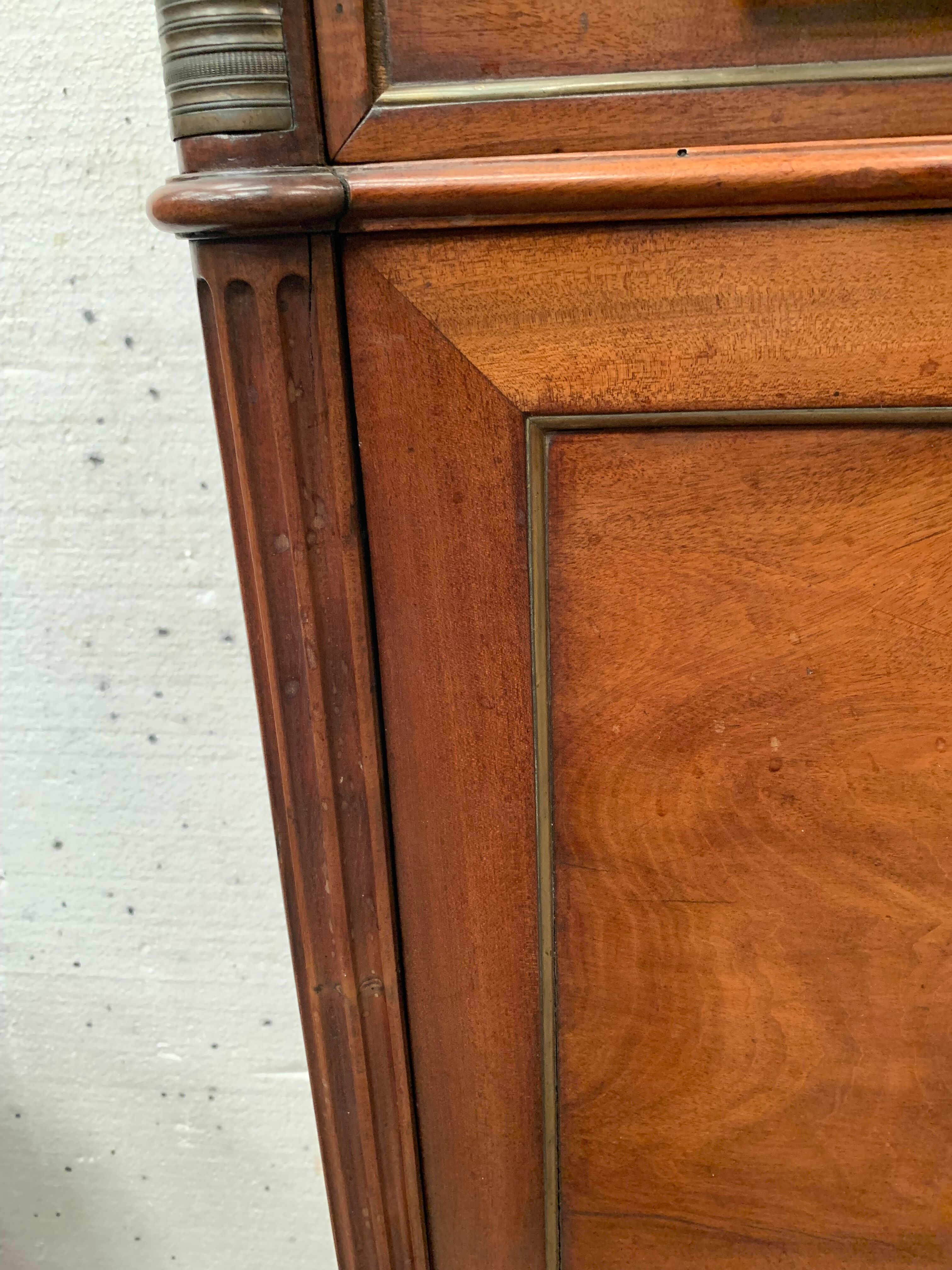 Secretary Louis XVI in mahogany Top of veined gray marble XIX century