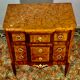 Transition style chest of drawers in rosewood and violet wood, ebony and gilded bronzes