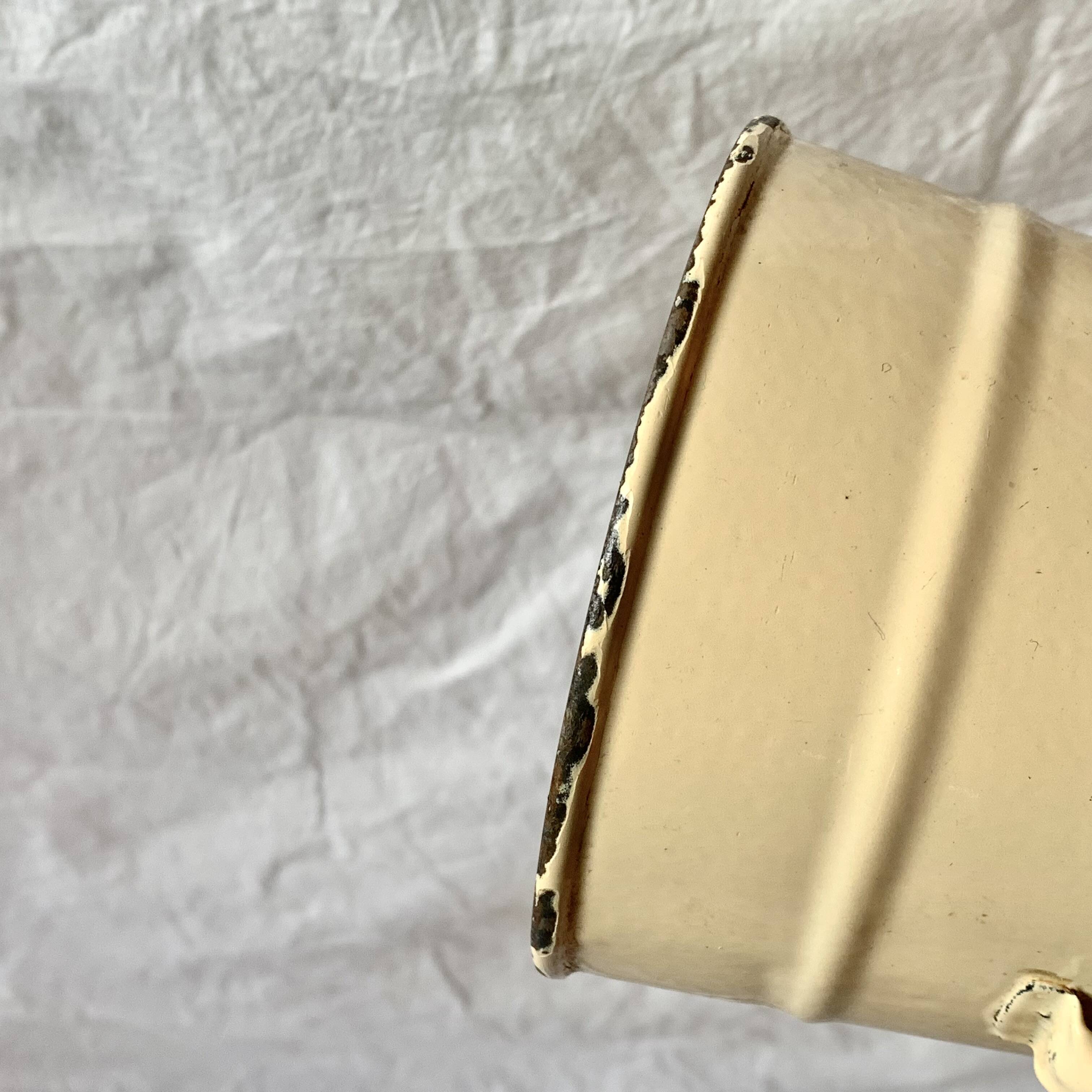 Vintage pitcher or jug in beige enamelled sheet metal