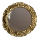 Round wooden mirror in golden colour.