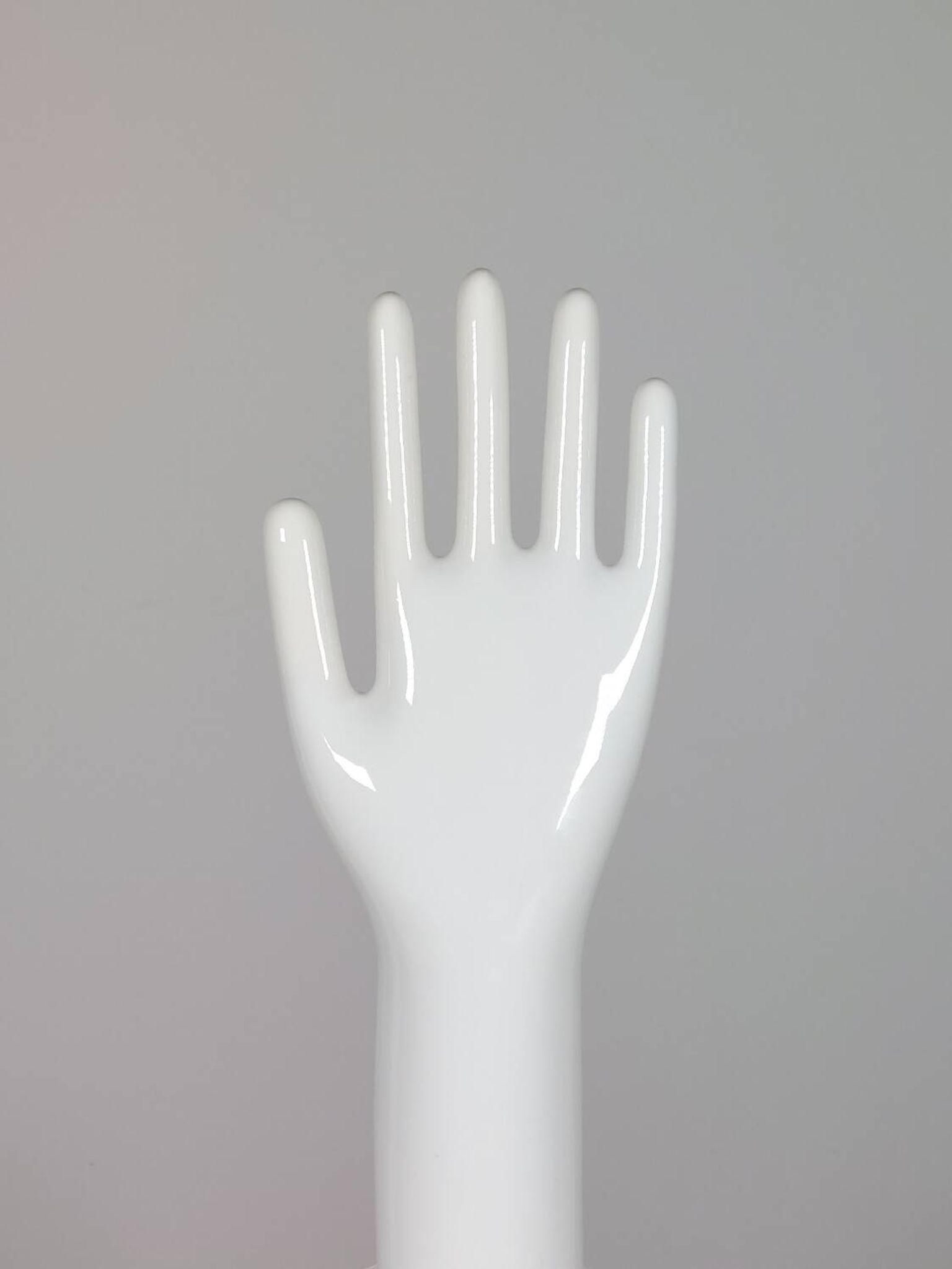 Pair of authentic vintage jewellery displays in industrial porcelain representing hands.
