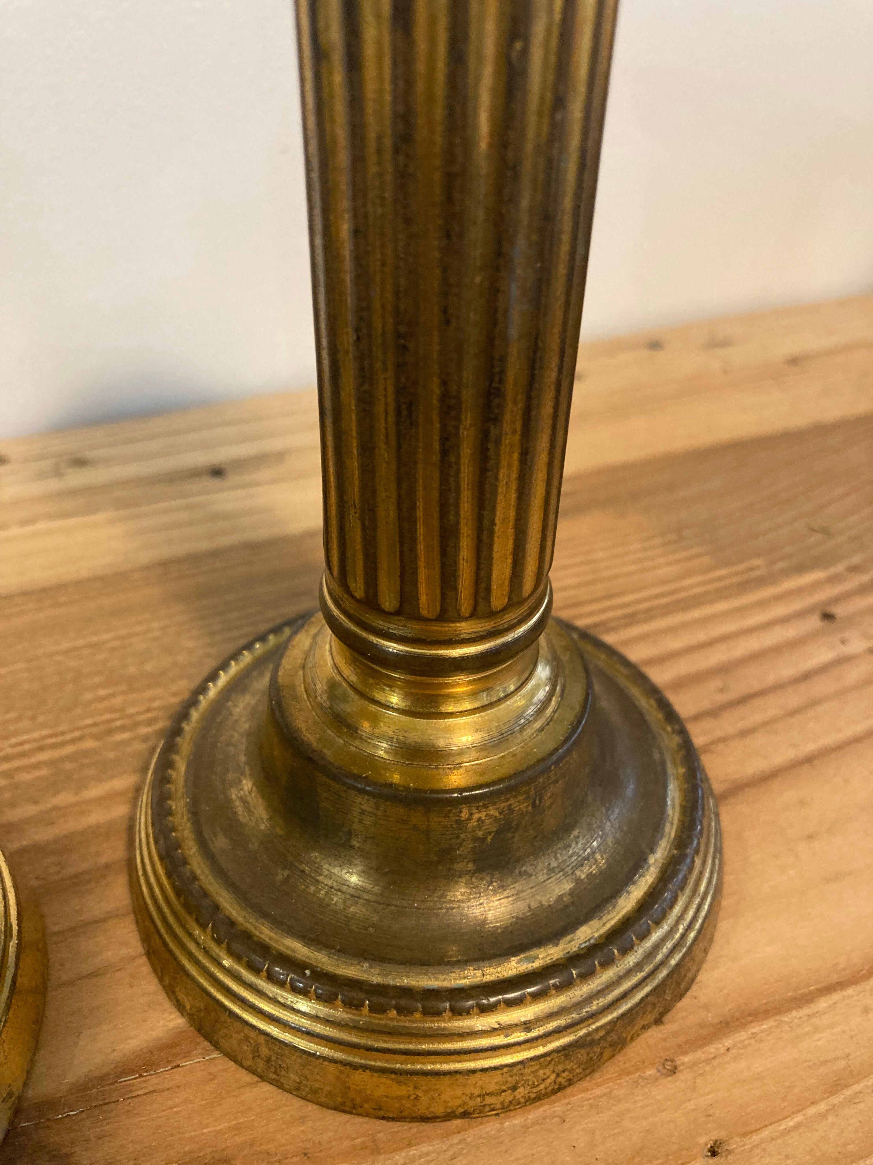 Pair of Louis XVI candlesticks in gilded bronze