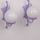 Wrought iron wall lights and glass spheres x2