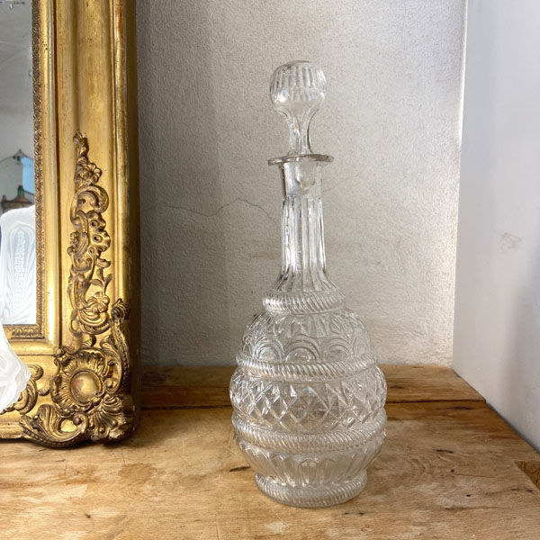 Large blown glass decanter and relief decoration