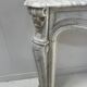 Louis XV style fireplace in veined white Carrara marble, 19th century.