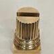 A pair of brass bookends representing columns.