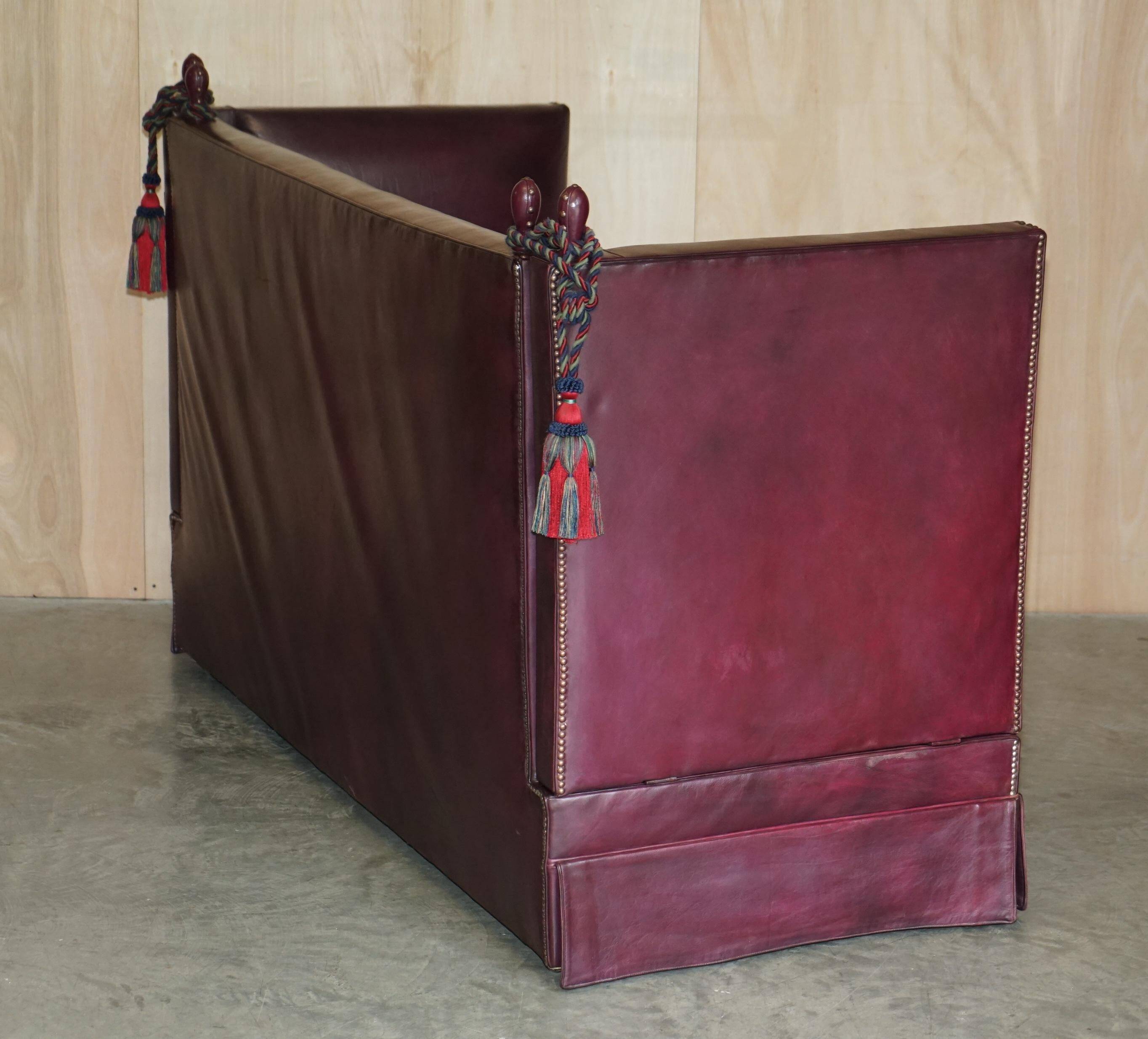 Victorian Knole canapé restored in leather with feather cushions.