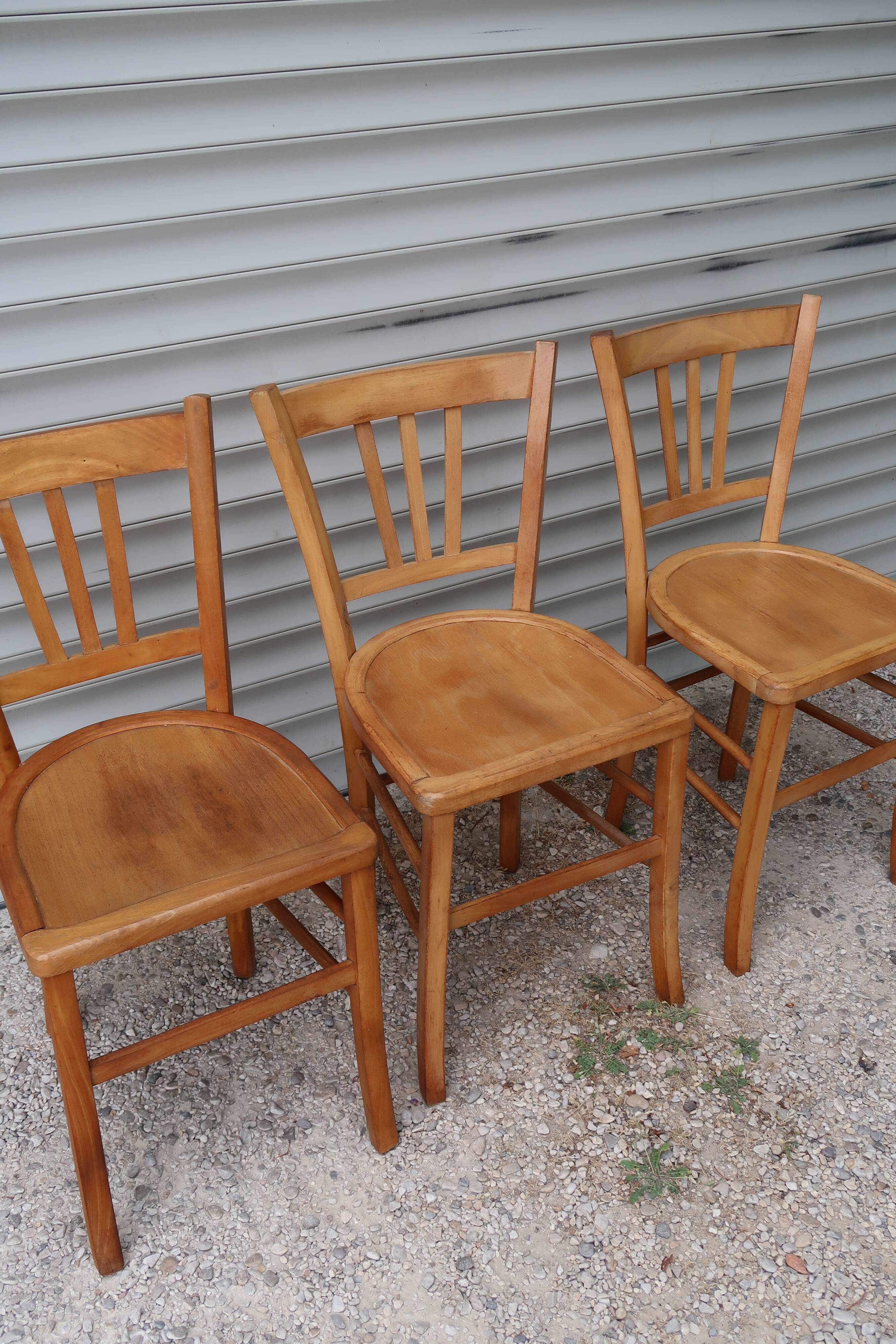 Set of 7 mismatched bistro chairs