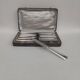Box of 12 table knives in silver metal, art deco period.