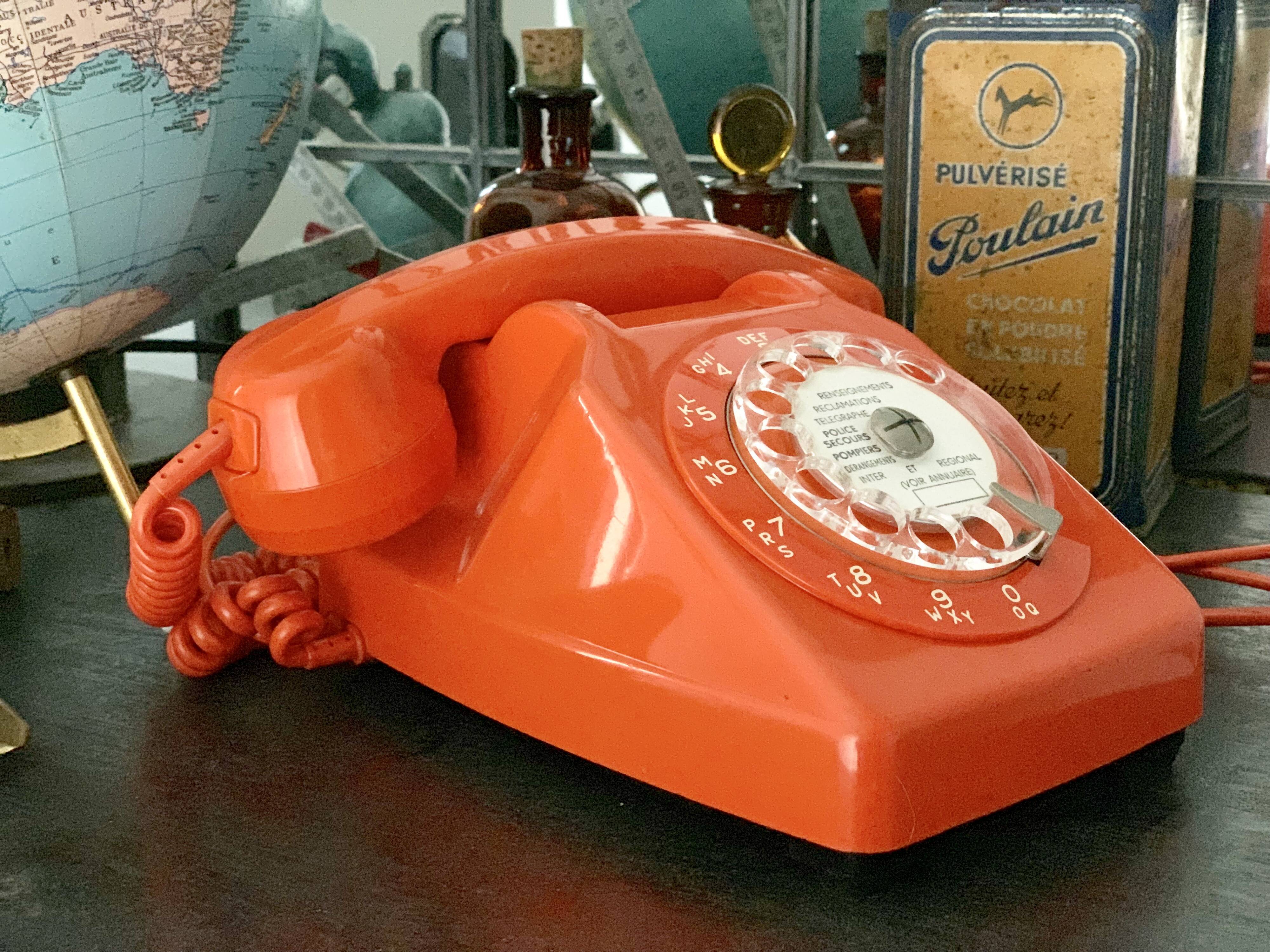 Old orange vintage dial phone
