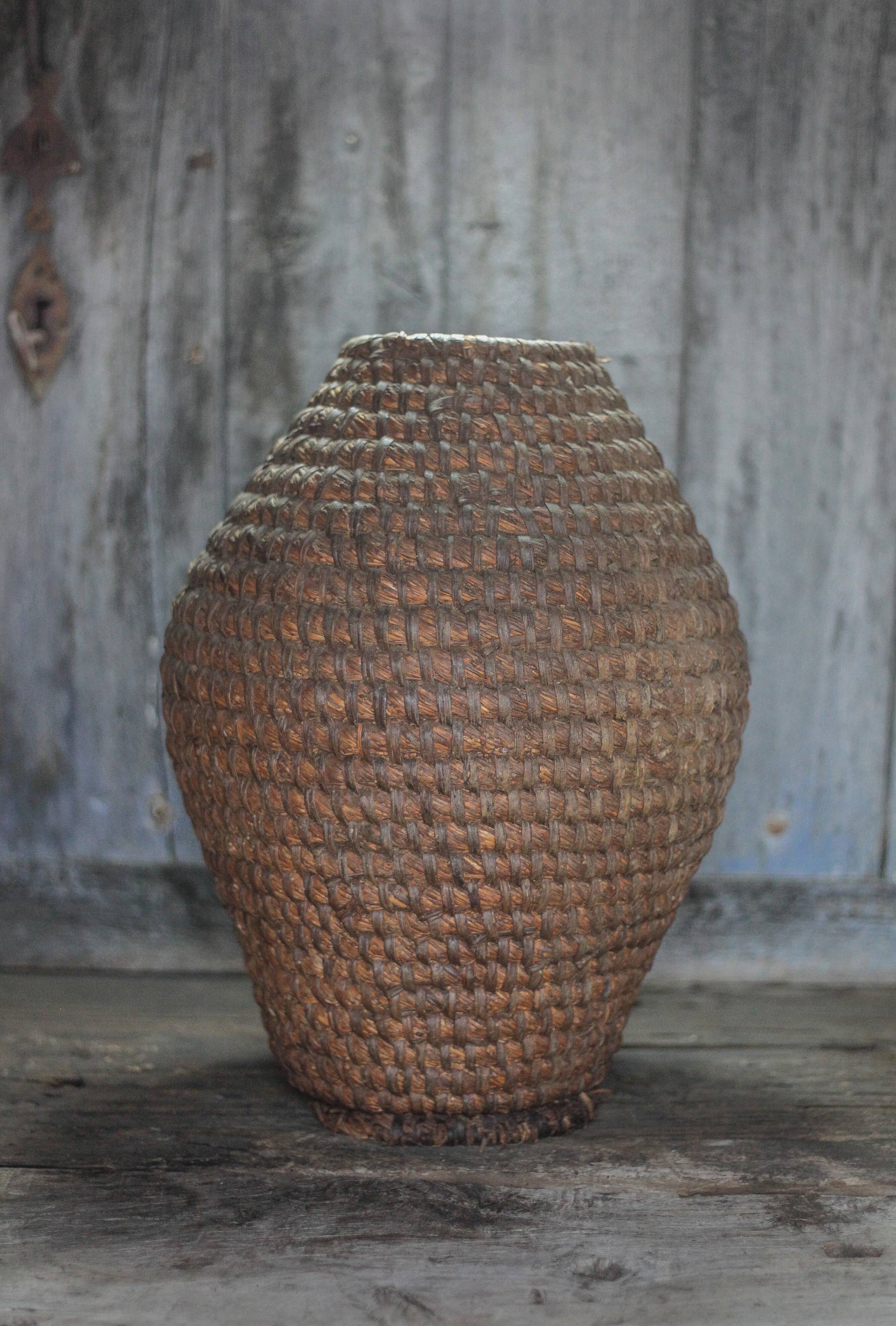 Old basket, straw and bramble bourgne, woven basket, interior decoration.