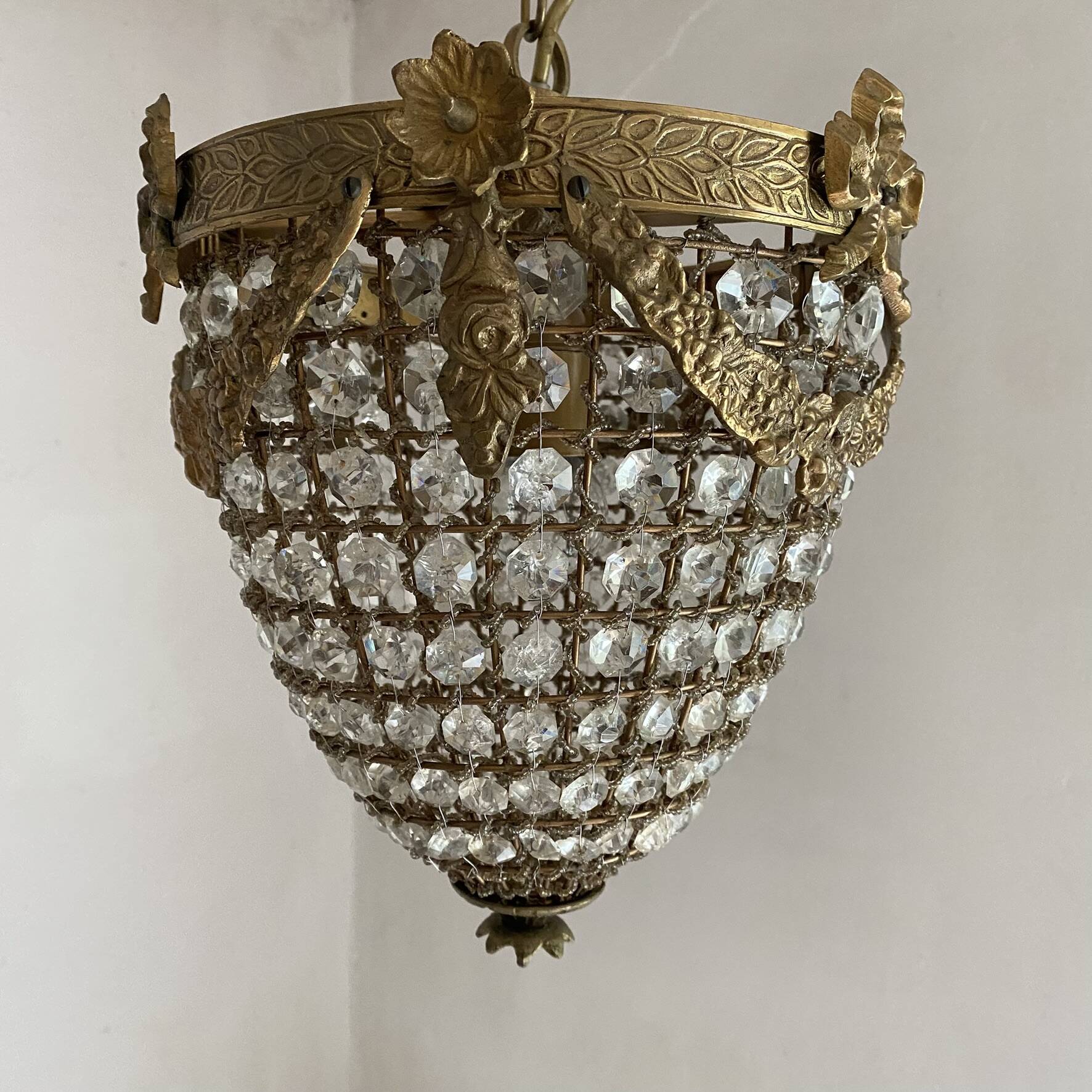 Brass basket chandelier with Louis XVI style pendants.