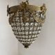 Brass basket chandelier with Louis XVI style pendants.