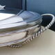 Oval-shaped covered gratin dish in Silver Metal