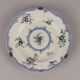 Antique earthenware plates with floral decoration from the 19th century.