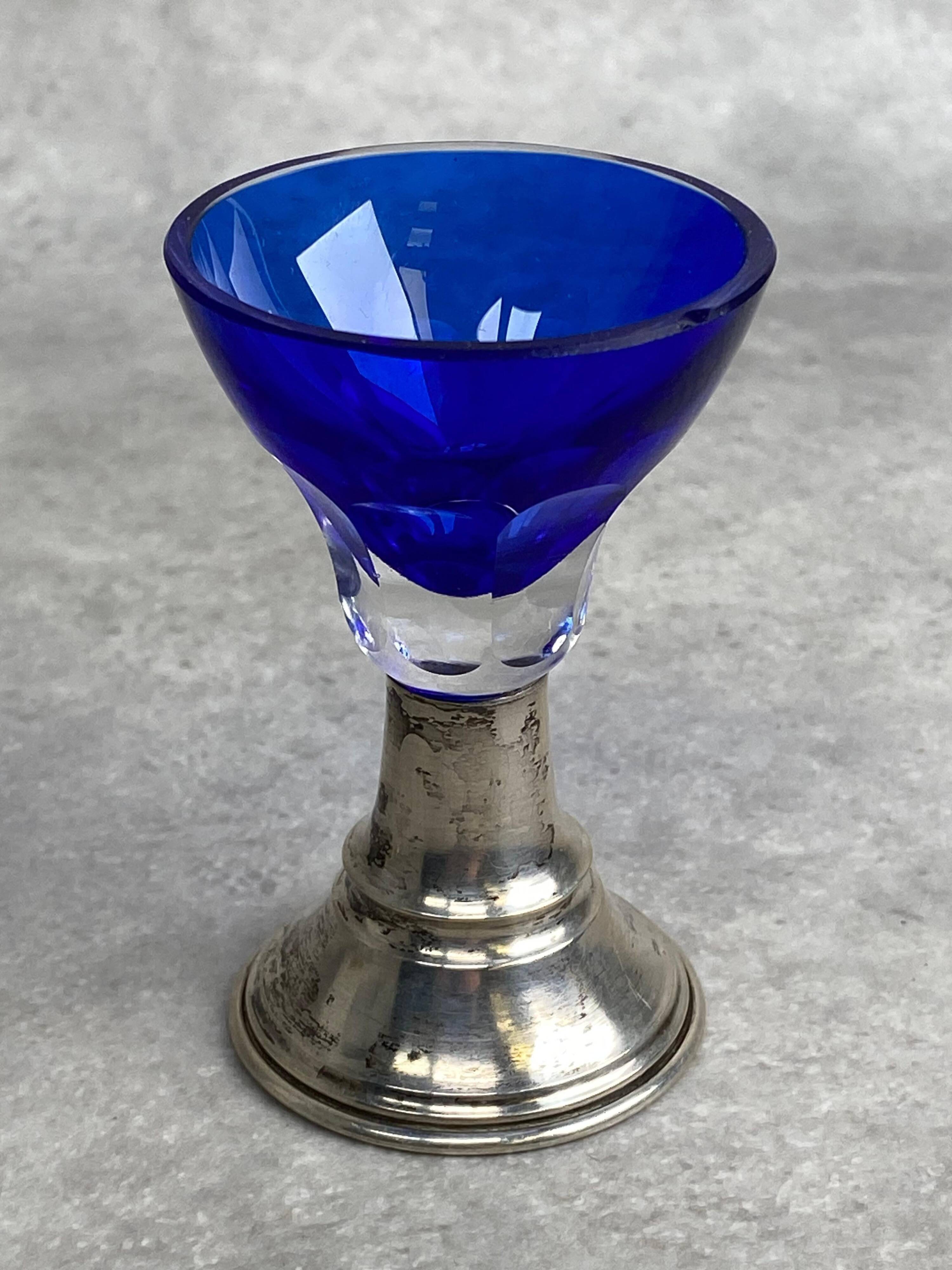 Set of 5 coloured stemmed glasses on silver stems.