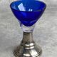 Set of 5 coloured stemmed glasses on silver stems.