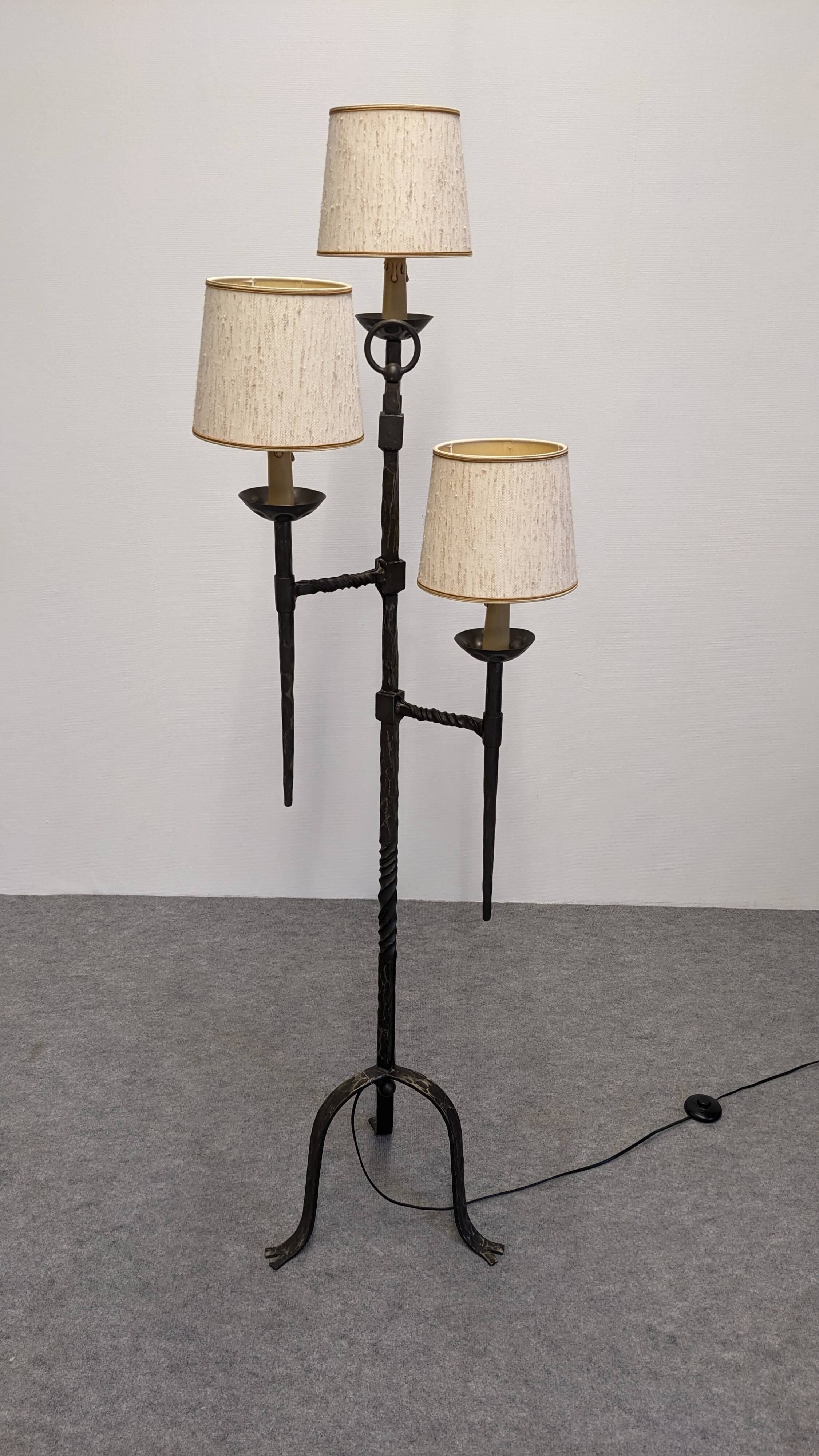 Brutalist tripod floor lamp with 3 lights in wrought iron, France circa 1950.