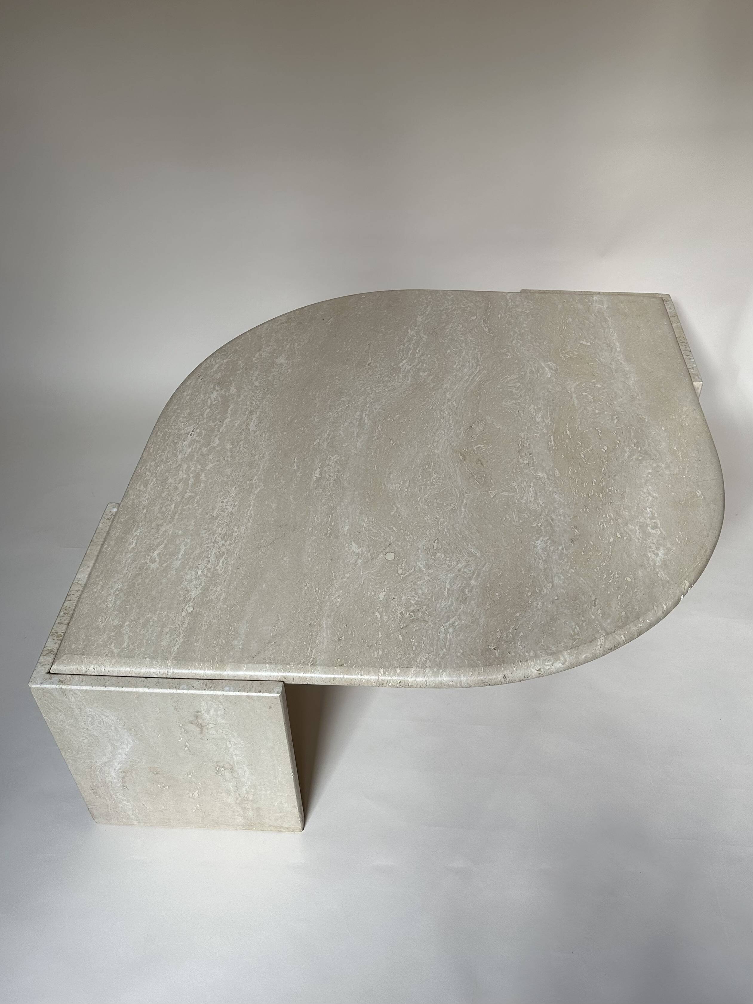 Travertine eye-shaped coffee table