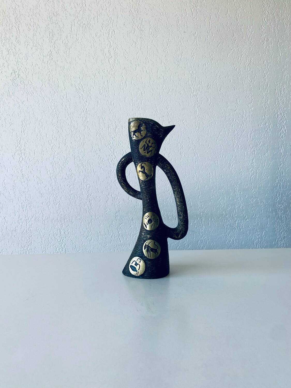 Brutalist bronze vase, the signs of the zodiac