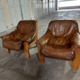 Armchairs in leather and vintage wood 70's