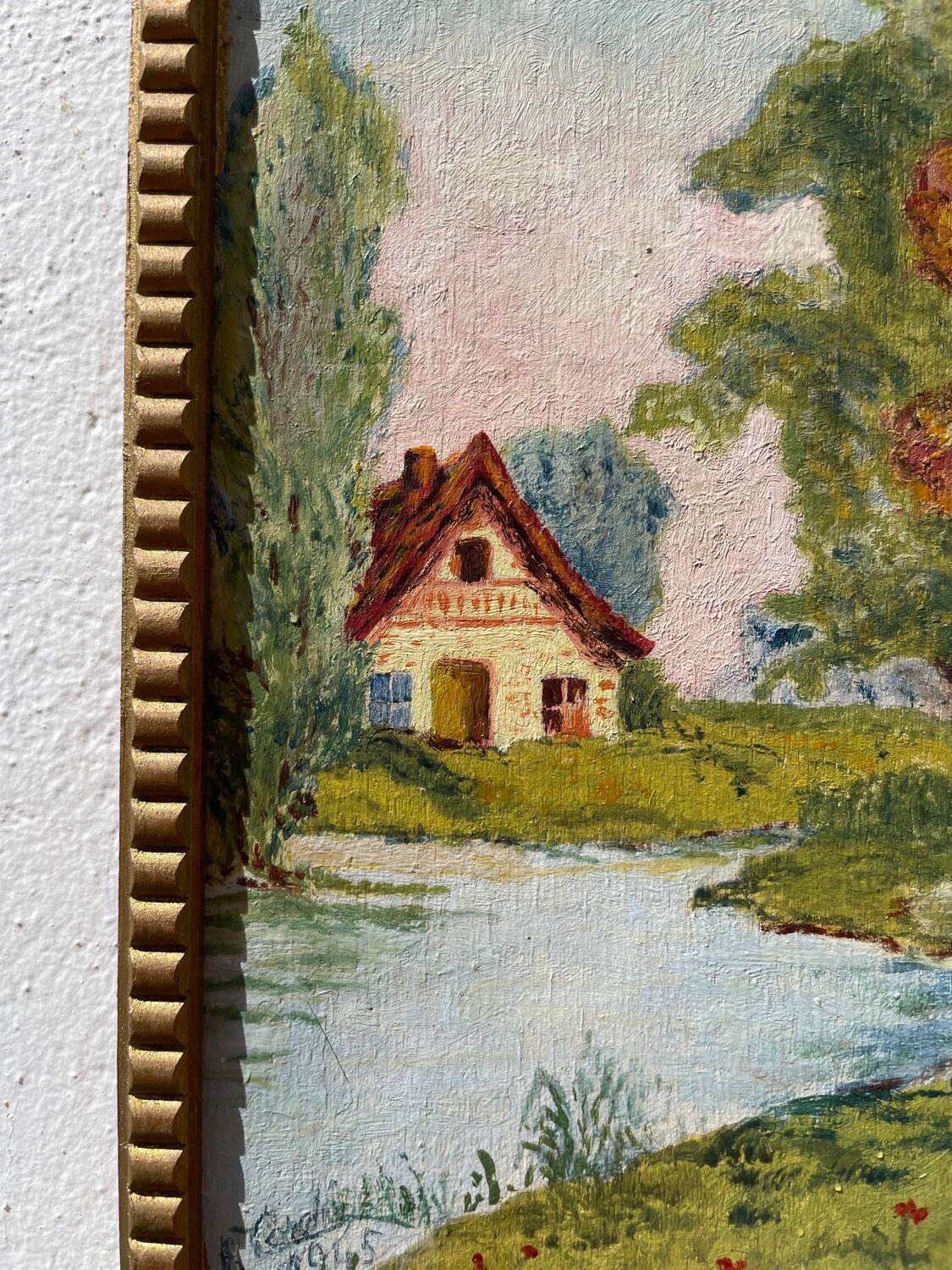 Small landscape painting with golden frame