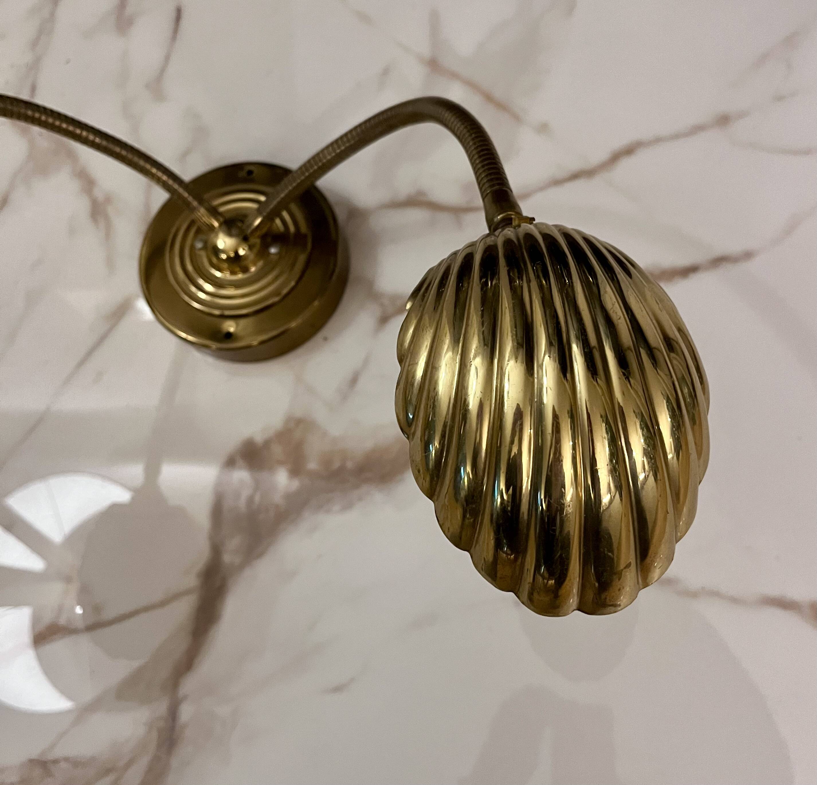Articulated shell wall light