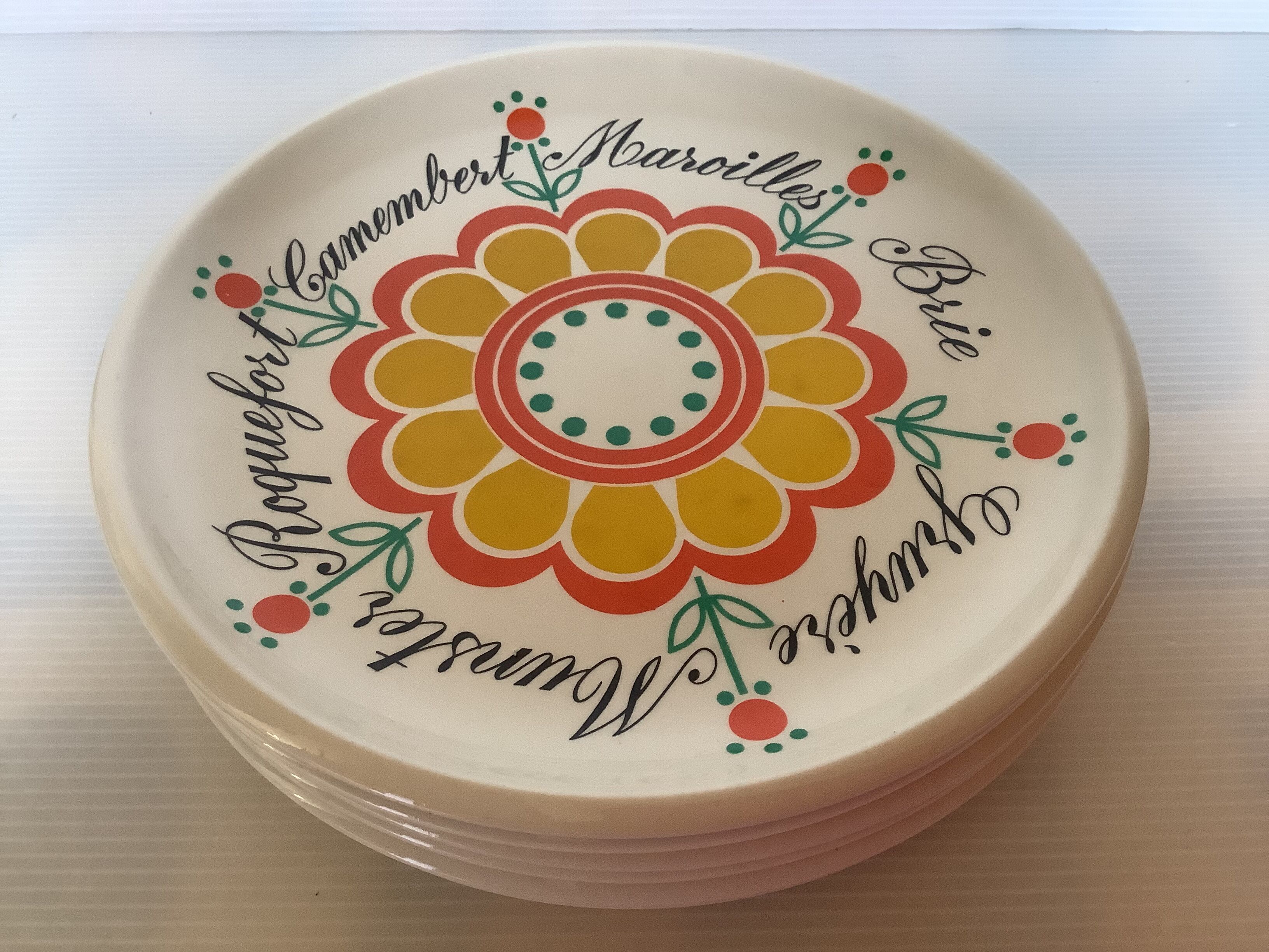 Six vintage floral cheese plates.