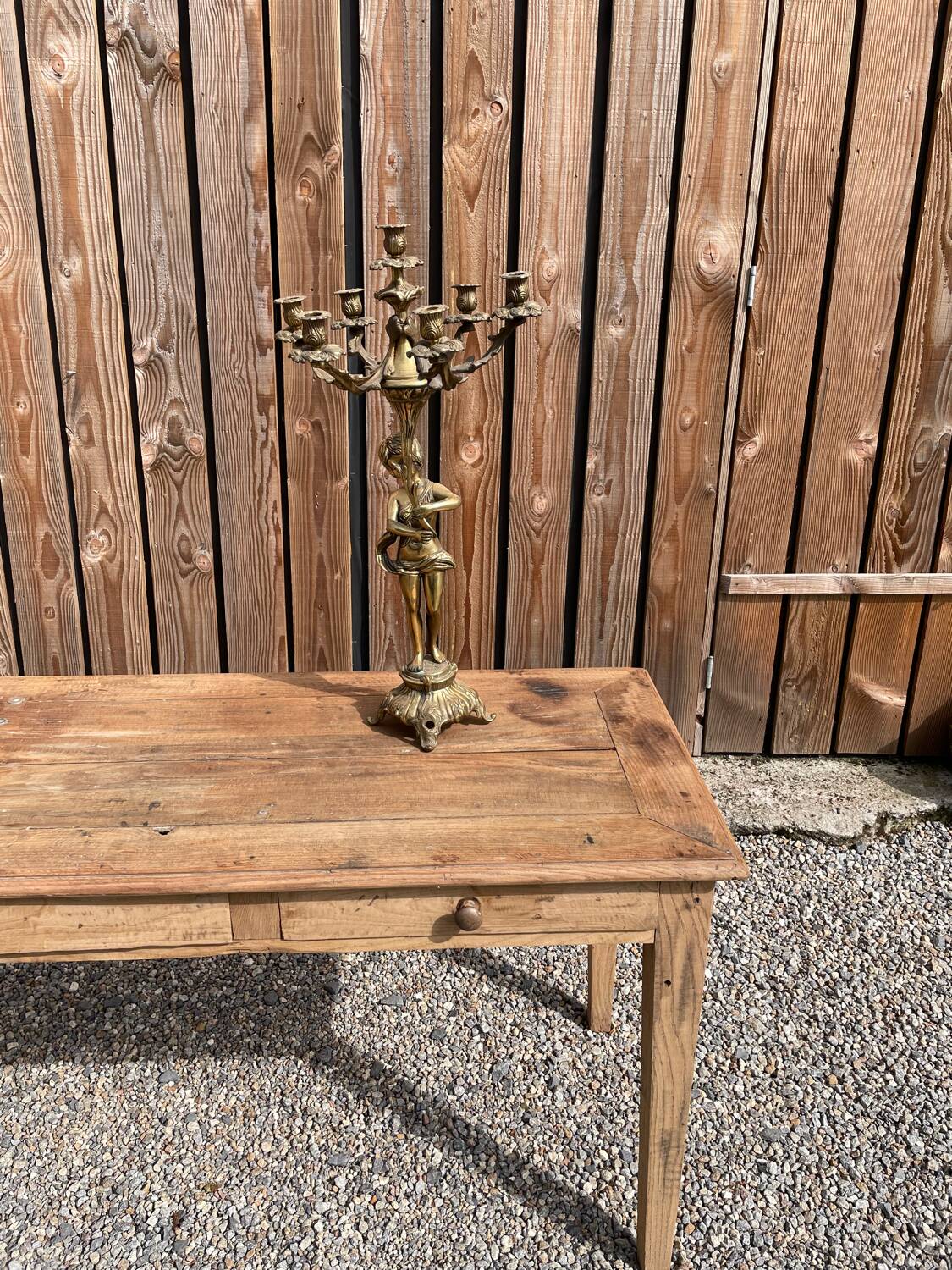 Large bronze candle holder with putti angel