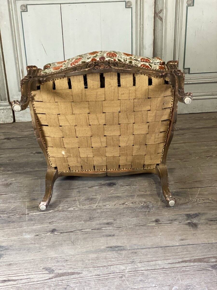 Regency style armchair in gilded wood