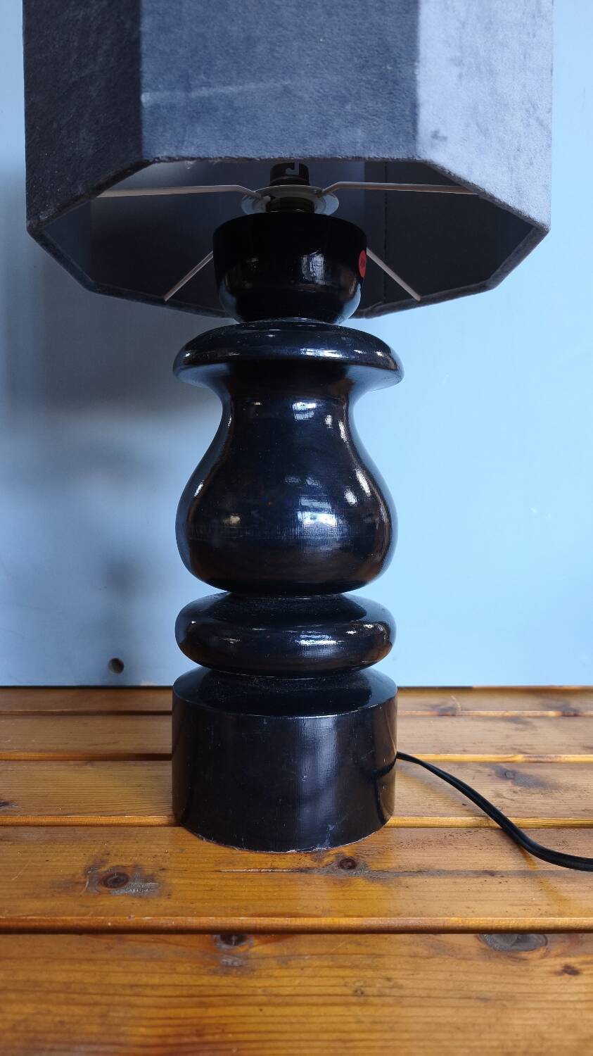 Sculptural table lamp made of turned wood