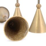 Trio of brass candlesticks by Christian de Beaumont