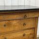 Commode Restauration XIXème en merisier et dessus marbre noir