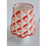 Small lamp with matte finish ceramic base and printed scalloped lampshade