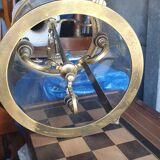 Suspension in glass and brass