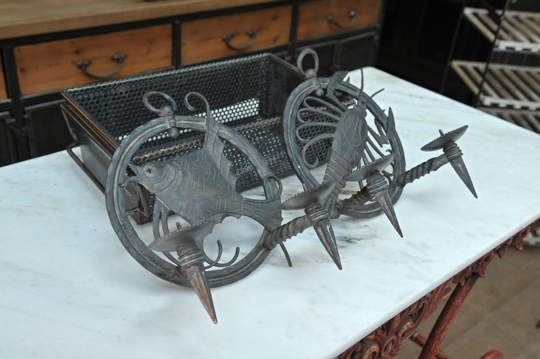 Pair of carved metal wall lamps signed RG