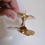 Two brass aviation propeller candle holders