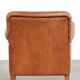 Sturdy vintage sheepskin armchair with a beautiful cognac colour