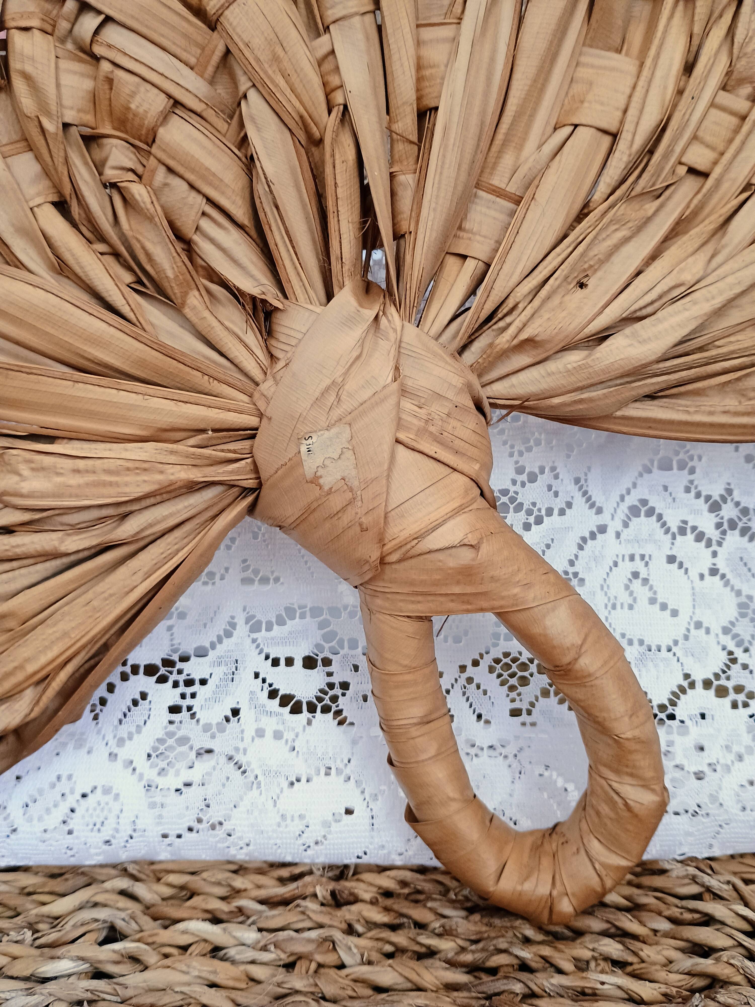 Heart fan in vintage woven palm leaves