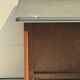 Modernist desk in wood and green moleskin upholstery